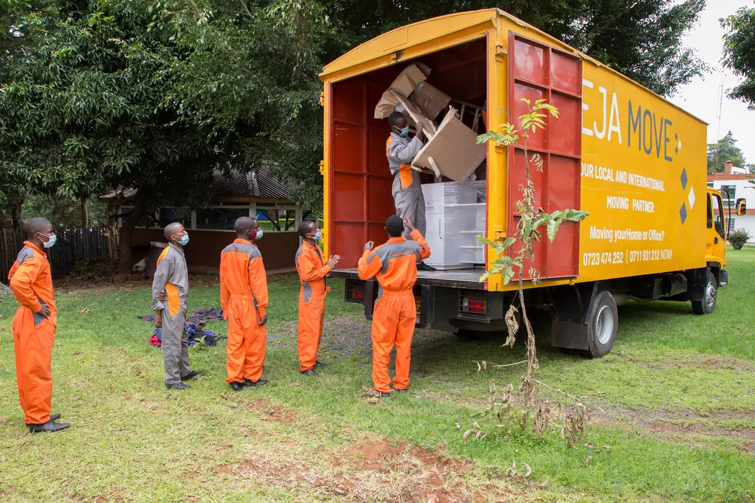 KejaMove crew carefully packing and loading household items during a move in Nairobi